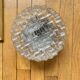 Wall lamp or ceiling light with minimalist porthole glass.