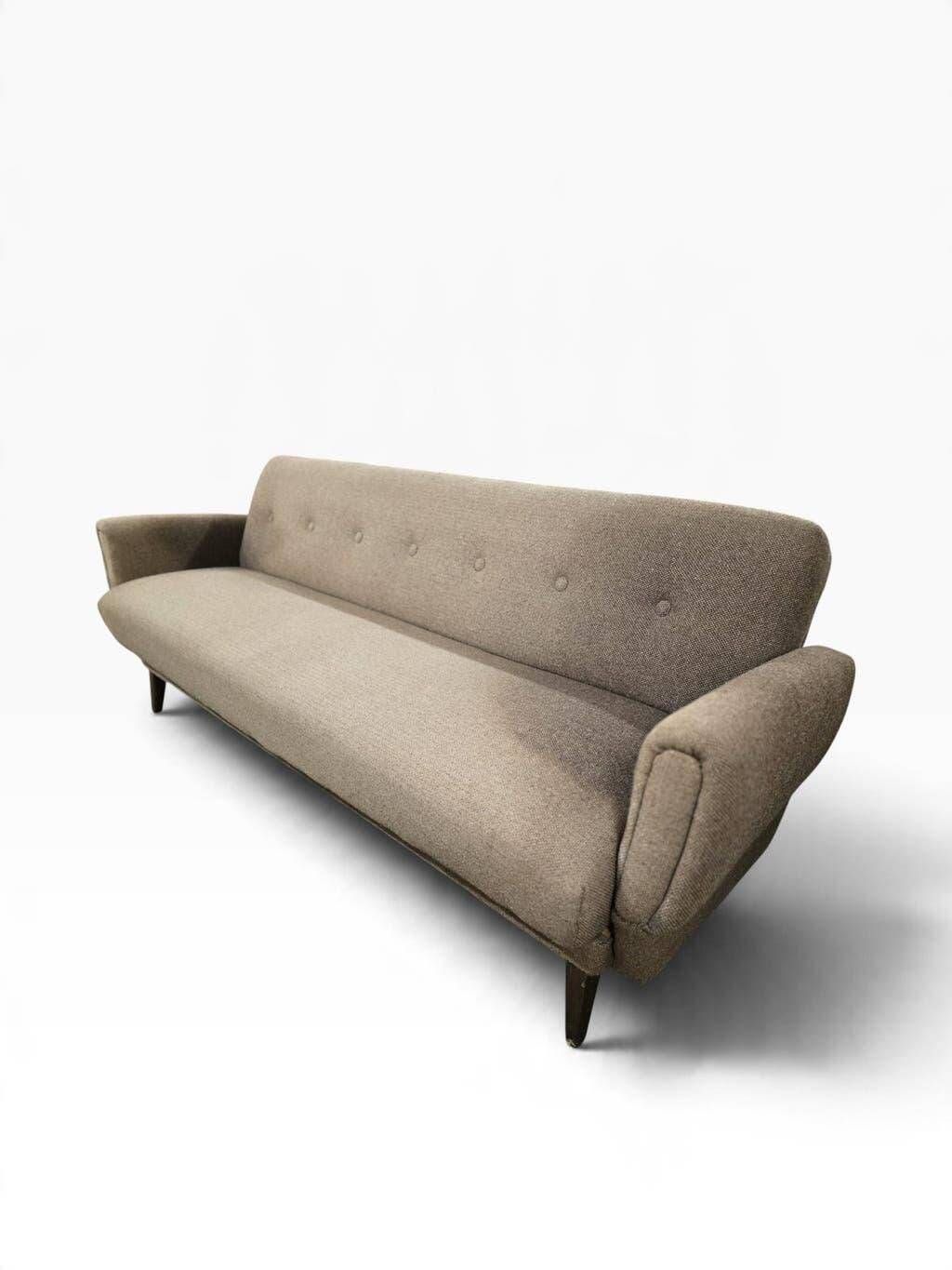 Vintage armchair/sofa/lounge in taupe colour with a stain.