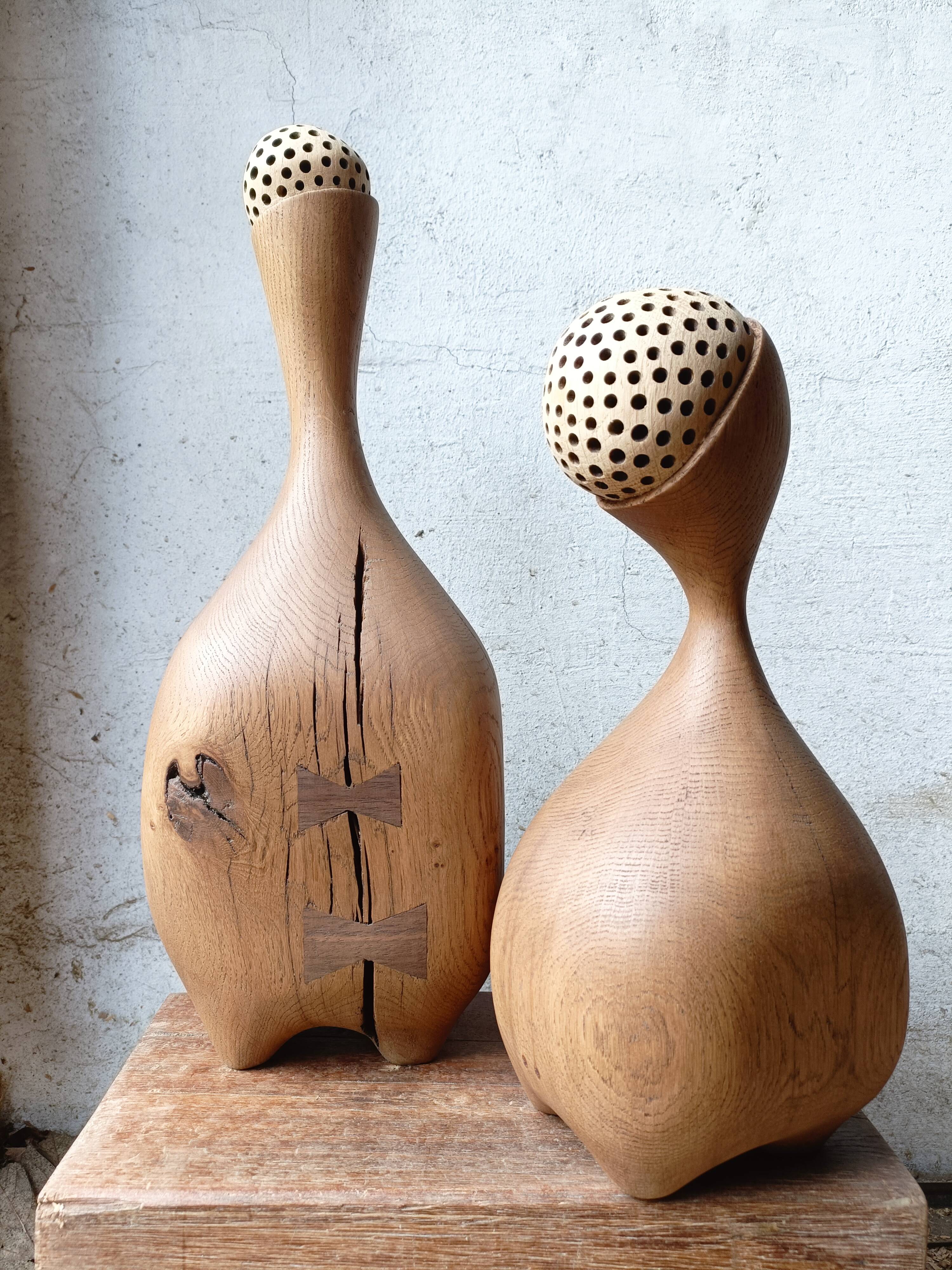 Set of two large solid oak sculptures.