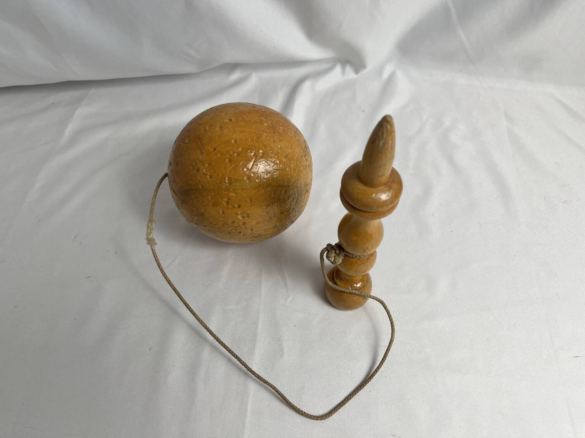 Old bilboquet toy in varnished wood 20th century