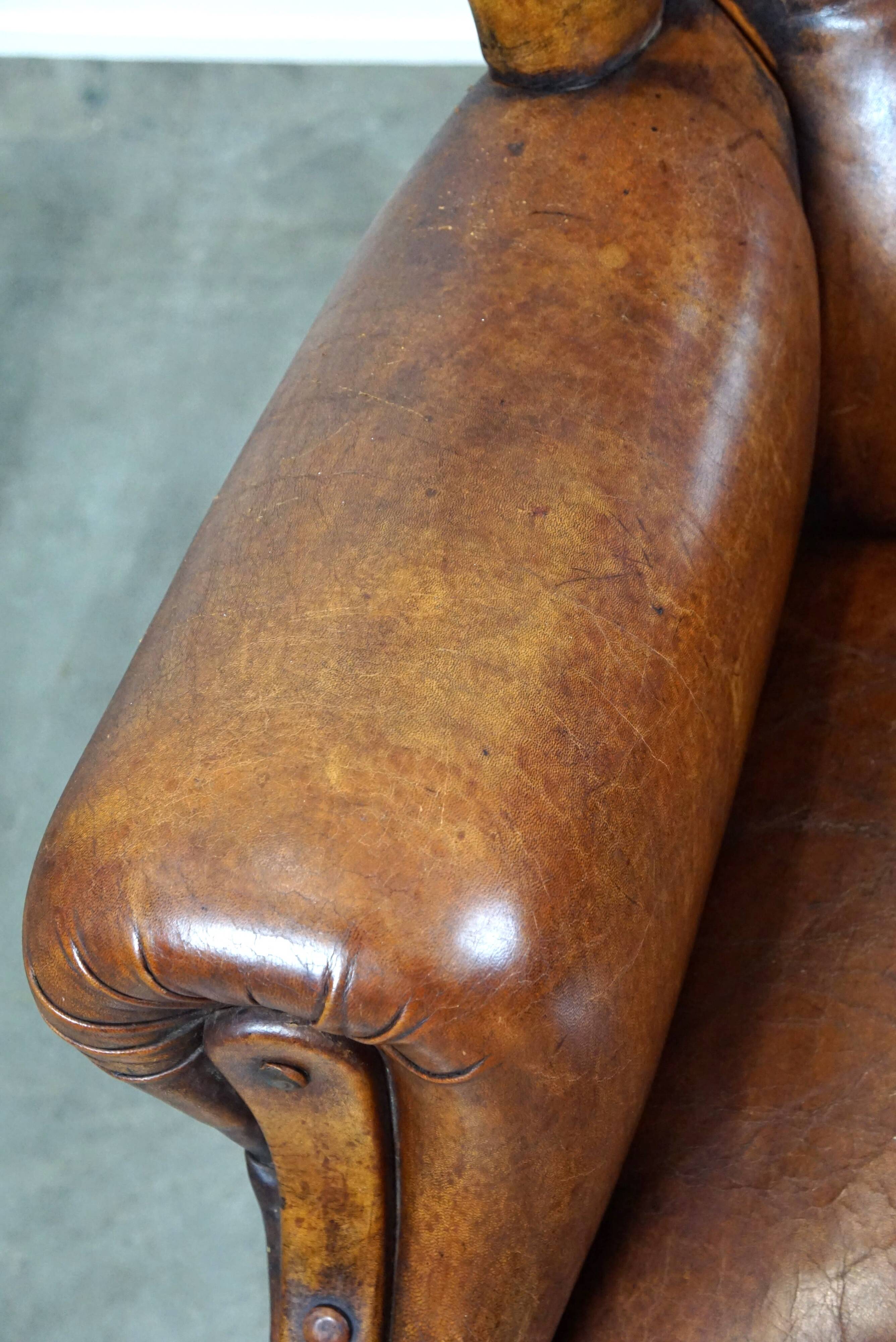 Irresistible old sheep leather wingback armchair with the most beautiful colors