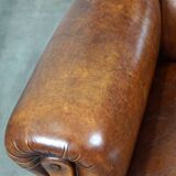 Irresistible old sheep leather wingback armchair with the most beautiful colors