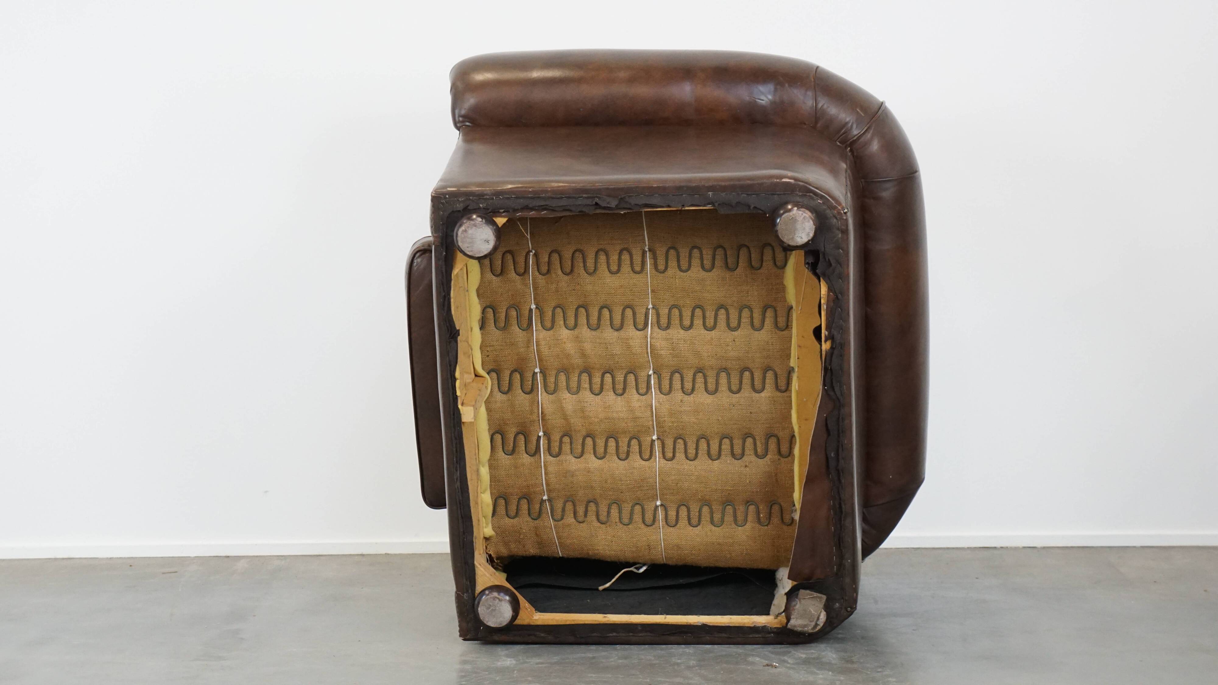 2 Chesterfield armchairs in dark brown cowhide