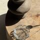 Petrified wood catchall or dish in beige with several grey spots in the centre.