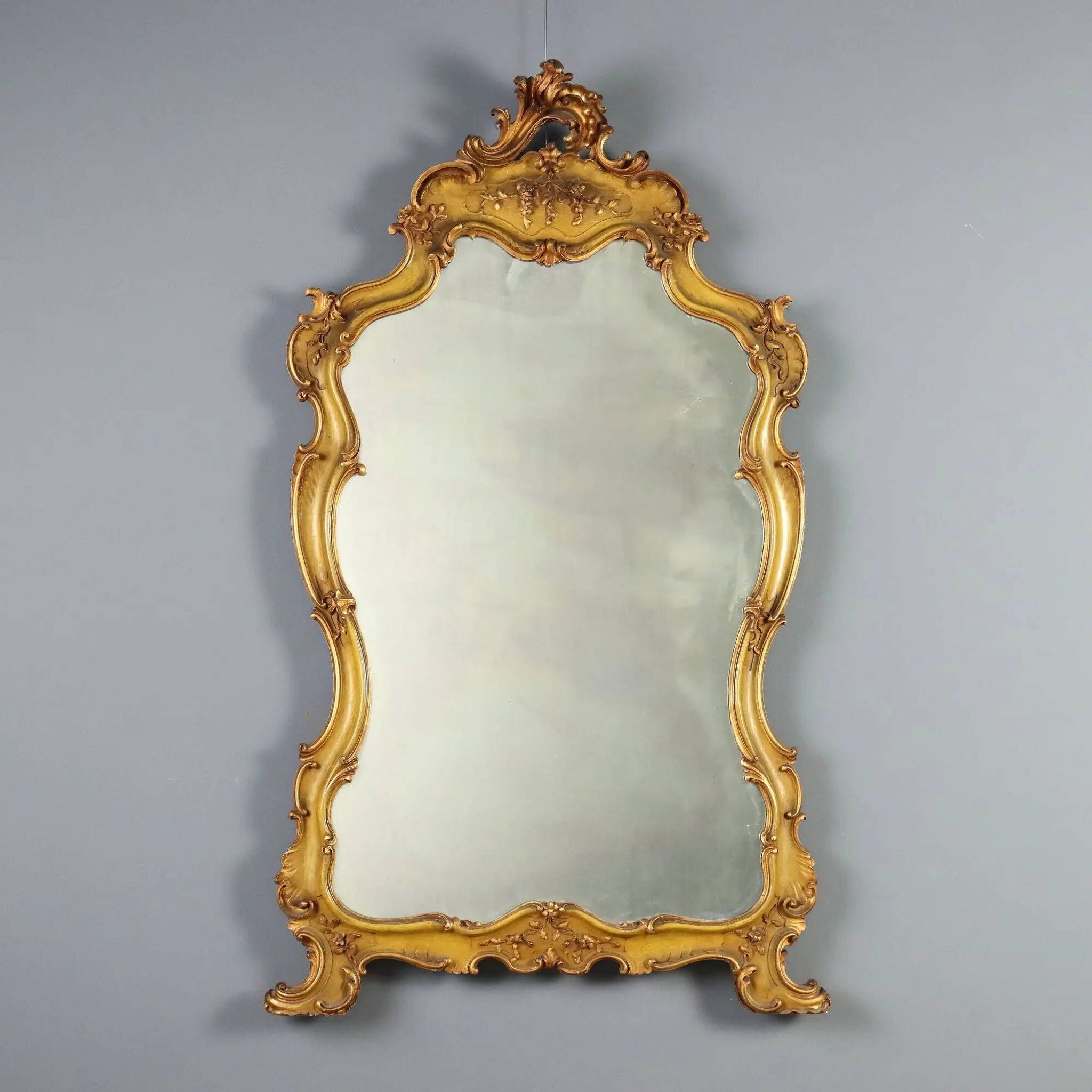 Antique baroque-style mirror in gilded carved wood, Italy 19th century.