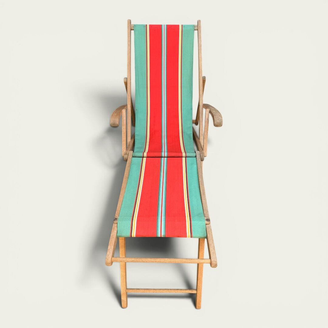 Vintage deck chair with striped green and red fabric, original patina.