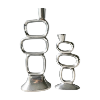Pair of cast aluminum candle holders, design