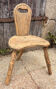 Rustic handmade children's chair, tree trunk, wabi-sabi spirit.
