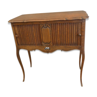 Piece of furniture with two Louis XV-style curtains.