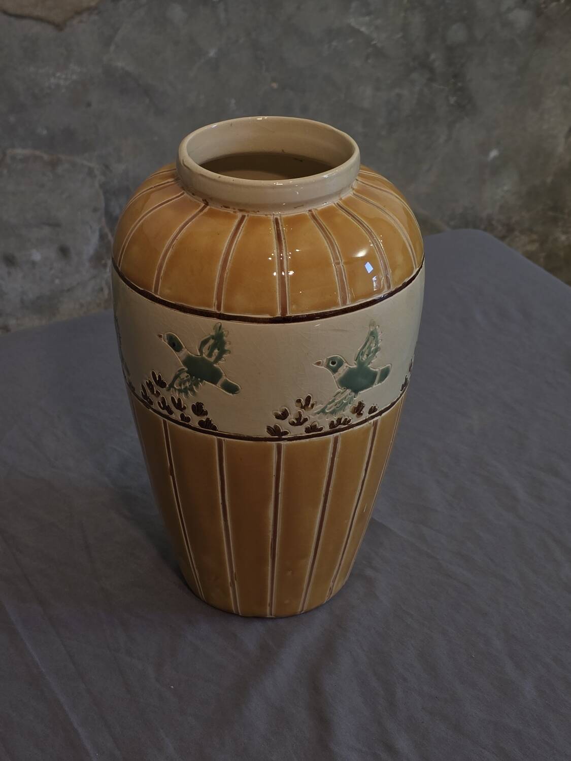Orange and green ceramic vase with duck motif