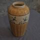 Orange and green ceramic vase with duck motif