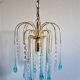 An ancient chandelier with blue tassels
