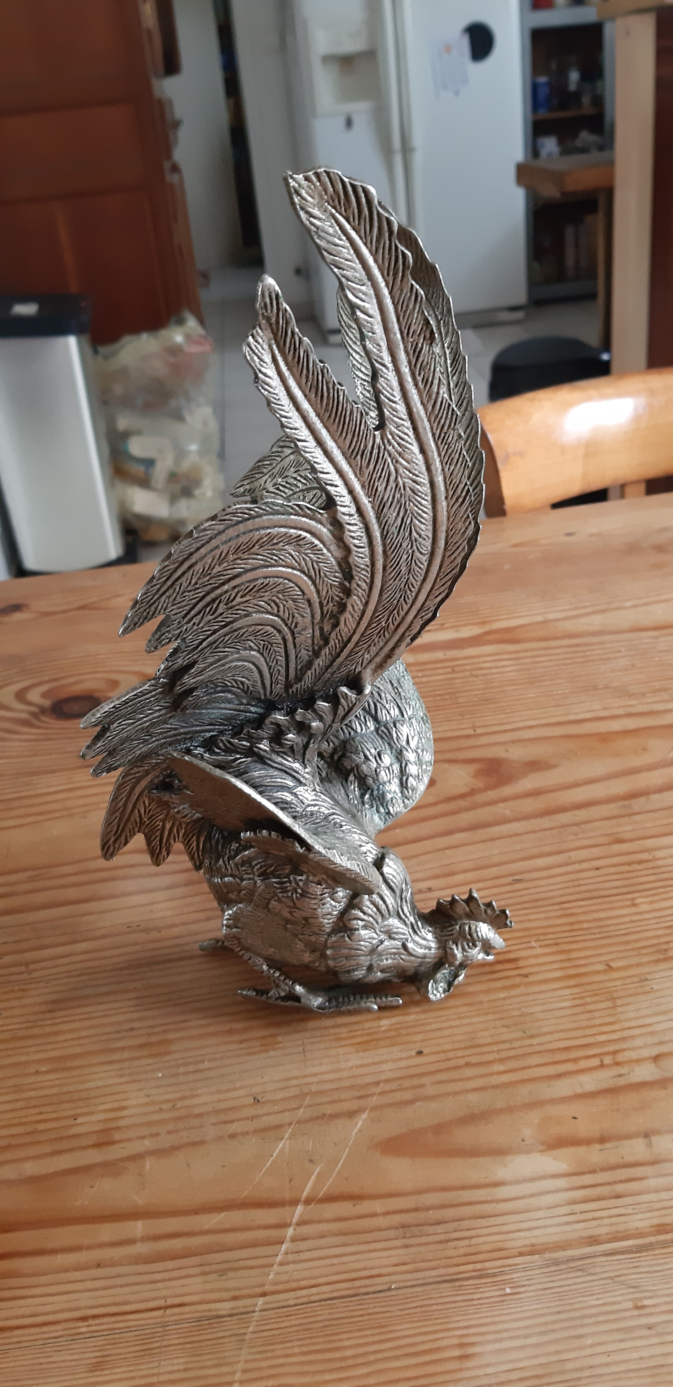 2 silver metal roosters