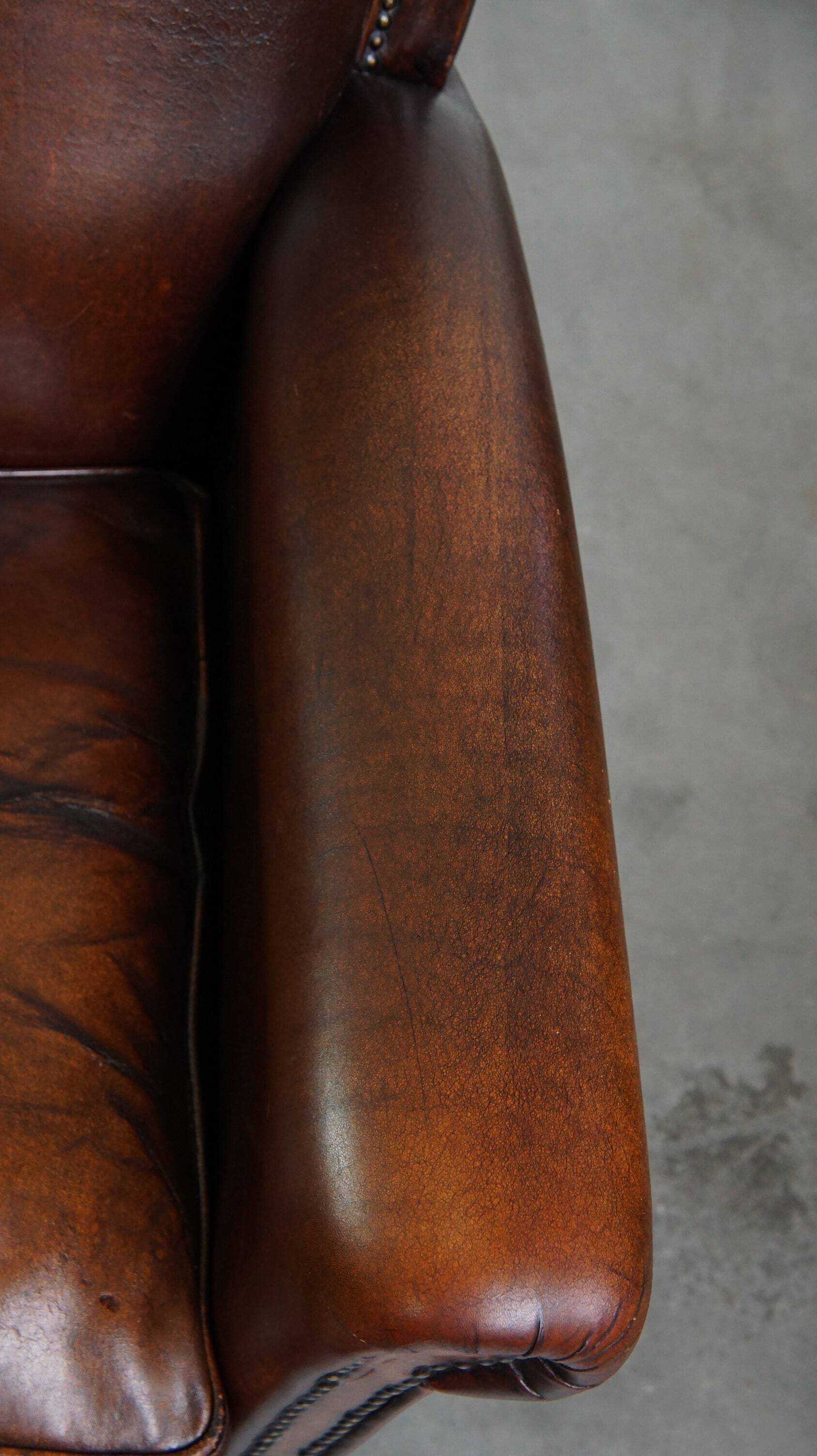 Vintage sheepskin armchair with beautiful warm colors and excellent seating comfort