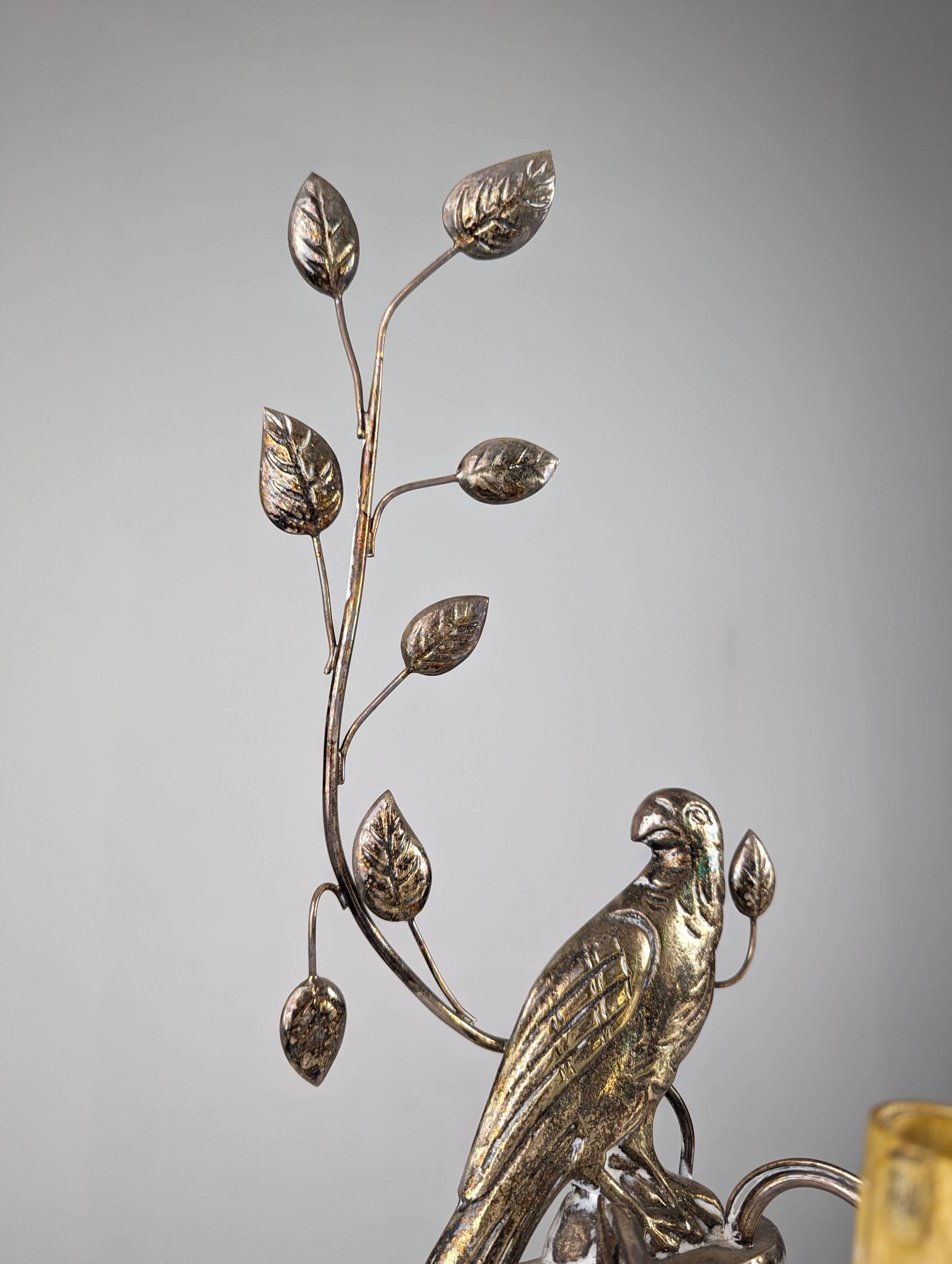 Pair of wall sconces with parrots and leaves