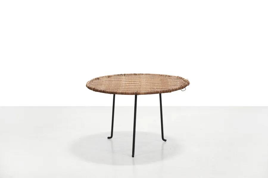 Round rattan side table by Raoul Guys
