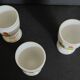 Porcelain egg cups with rooster decoration, set of three