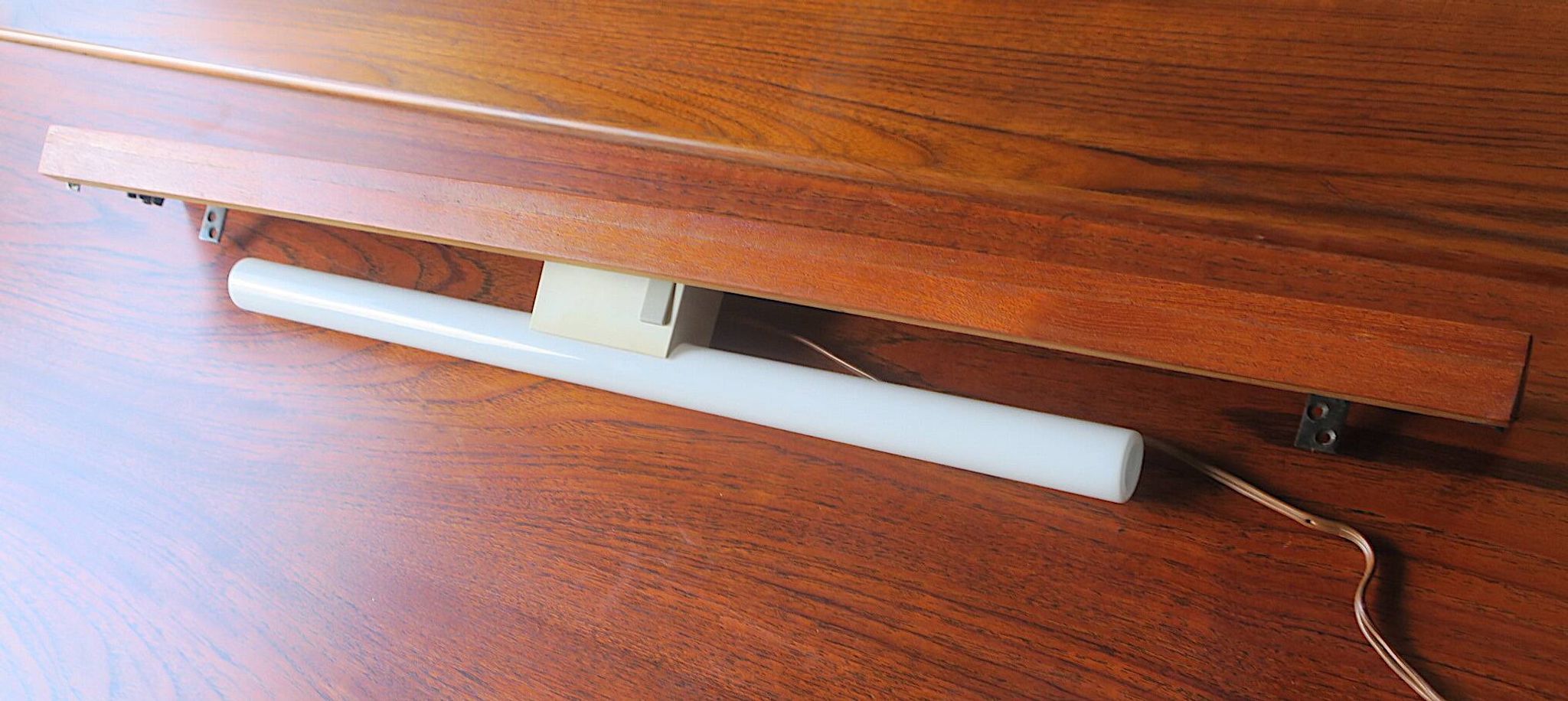 Pairb of Danish teak shelves with wall lights, 1960s
