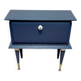 Old bedside table with compass feet