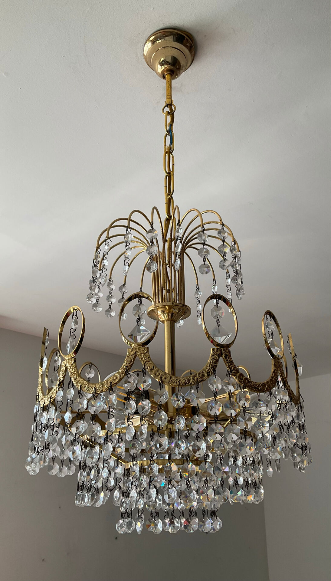 Brass chandelier with crystal pendants from the 1970s.