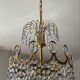 Brass chandelier with crystal pendants from the 1970s.