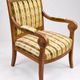 Antique armchair with wooden crossbars – Restoration style