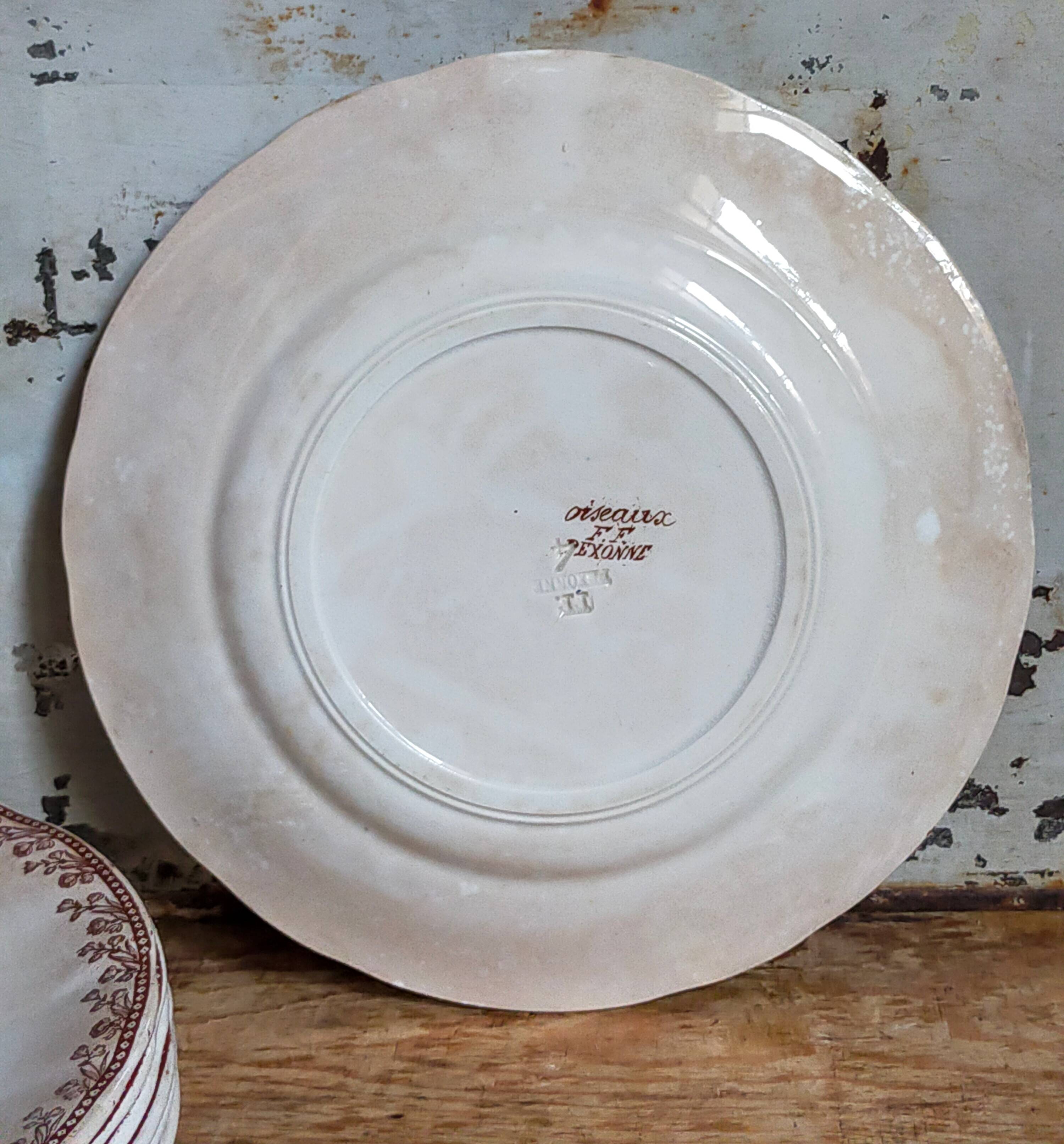 Seven iron earth dessert plates with birds ffPexonne late 19th century