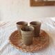 3 vintage 70s glazed stoneware cups and the wicker tray.