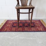 Tapis d’Orient bleu rouge avec franges
