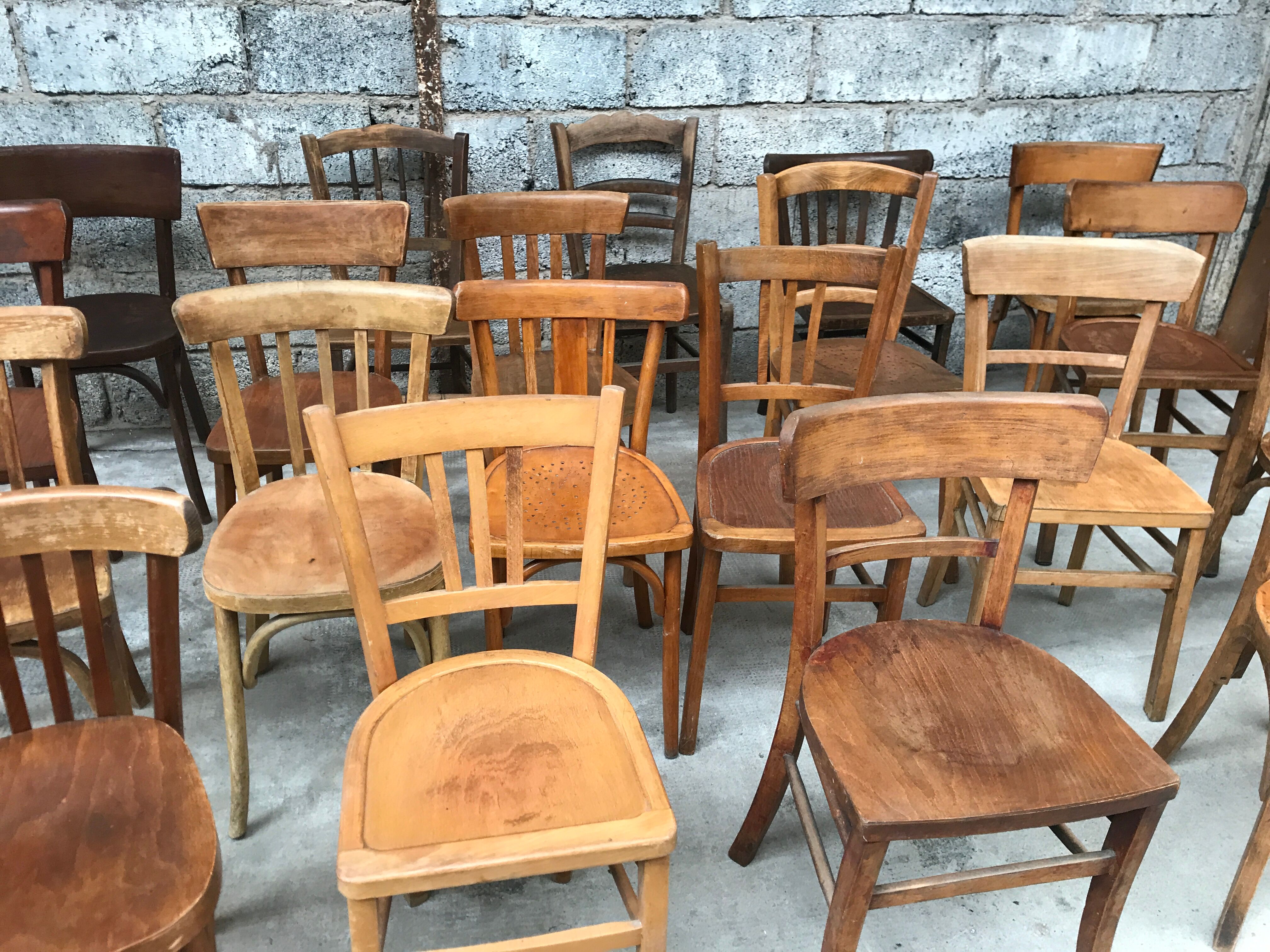 Set of 15 mismatched curved wood bistro chairs