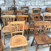 Set of 15 mismatched curved wood bistro chairs