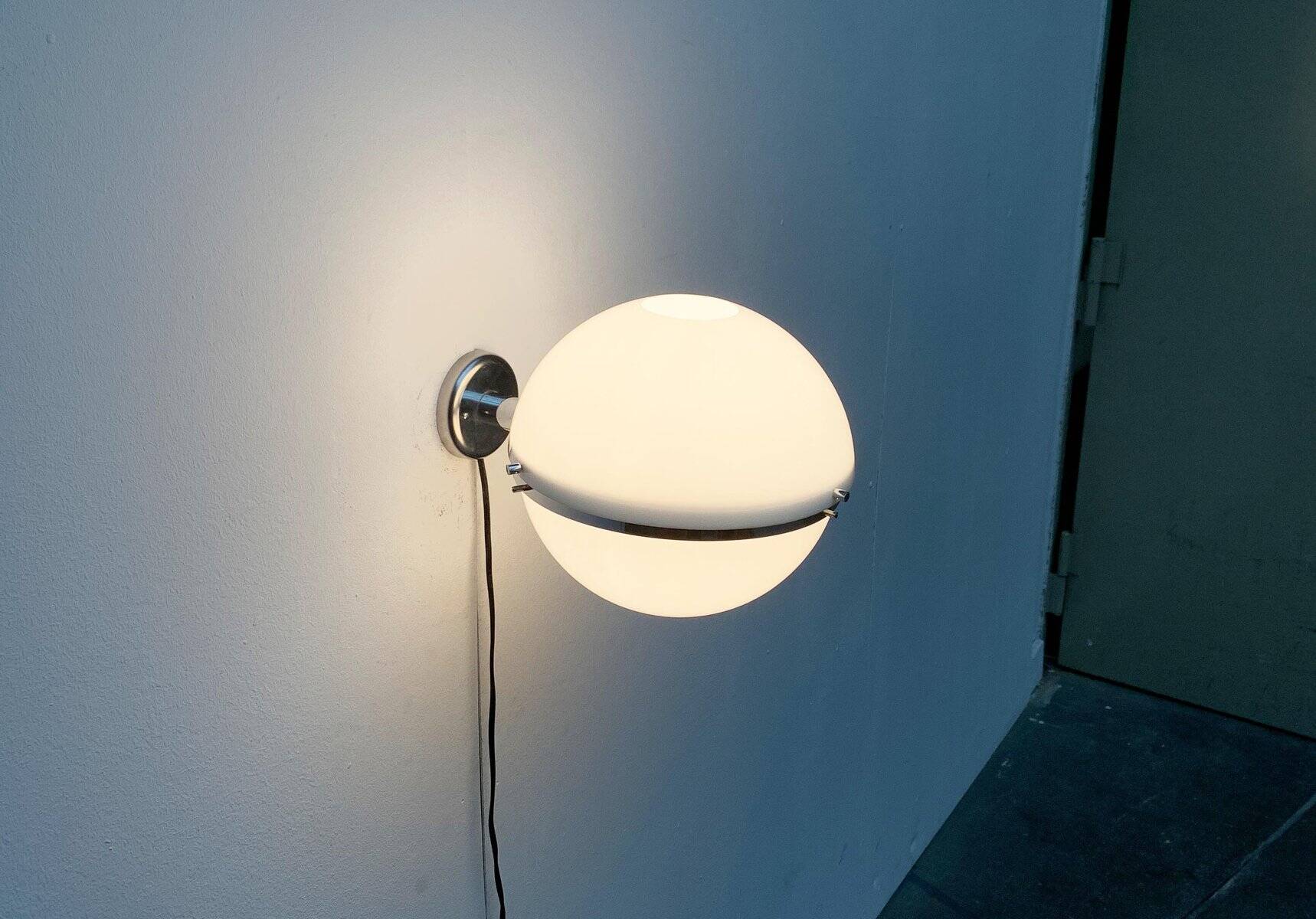 Mid-century Italian space age spherical wall light by Guzzini.