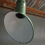 Old industrial enamel lamp in green