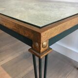 Patinated and gilded steel coffee table in the style of Jacques Quinet.
