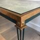 Table basse en acier patiné et doré dans le goût de Jacques Quinet