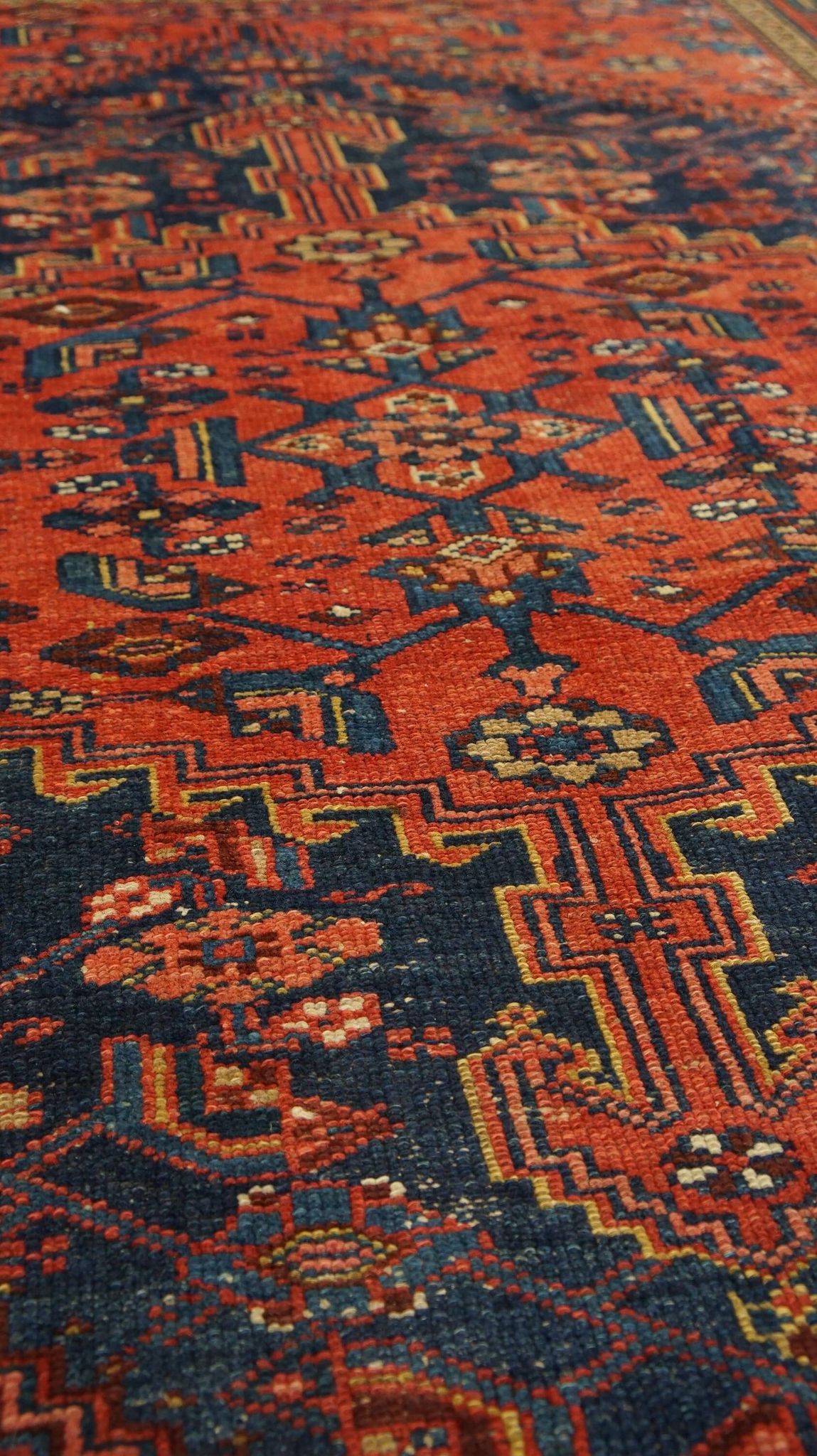 Antique hand-knotted oriental rug with predominantly red, purple, and blue colors 182x136cm