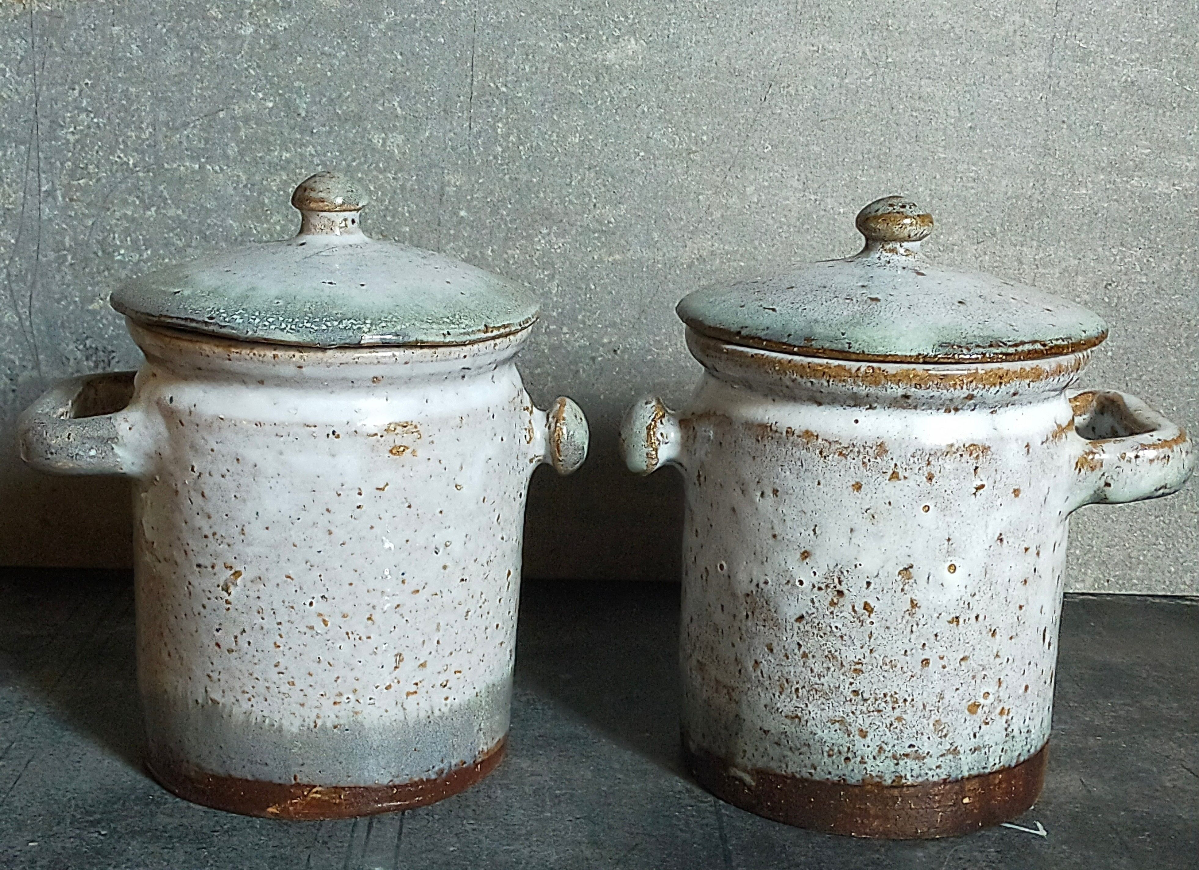 Duo of potter's pots covered in vintage glazed stoneware