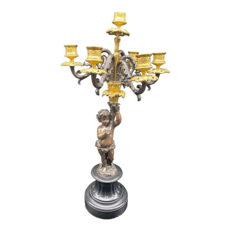 Candelabra with cherub in patinated bronze