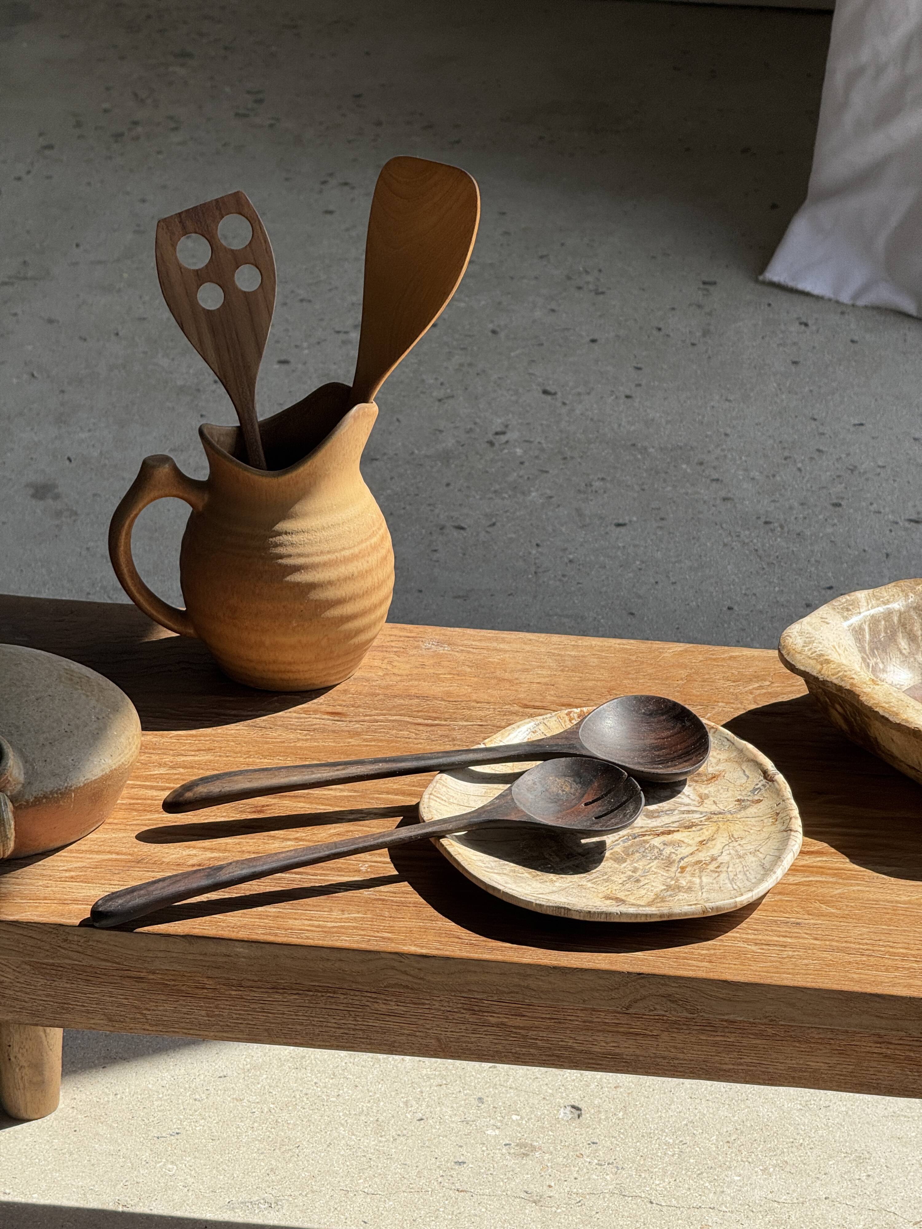 Pair of salad servers or kitchen utensils in blackened teak L30 D9