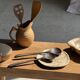 Pair of salad servers or kitchen utensils in blackened teak L30 D9