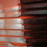 Set of 12 forks and 11 dessert knives from the 1950s. Wooden handles and box.
