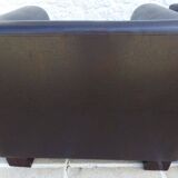 2 club armchairs with a chocolate faux leather seat and backrest and wooden legs.