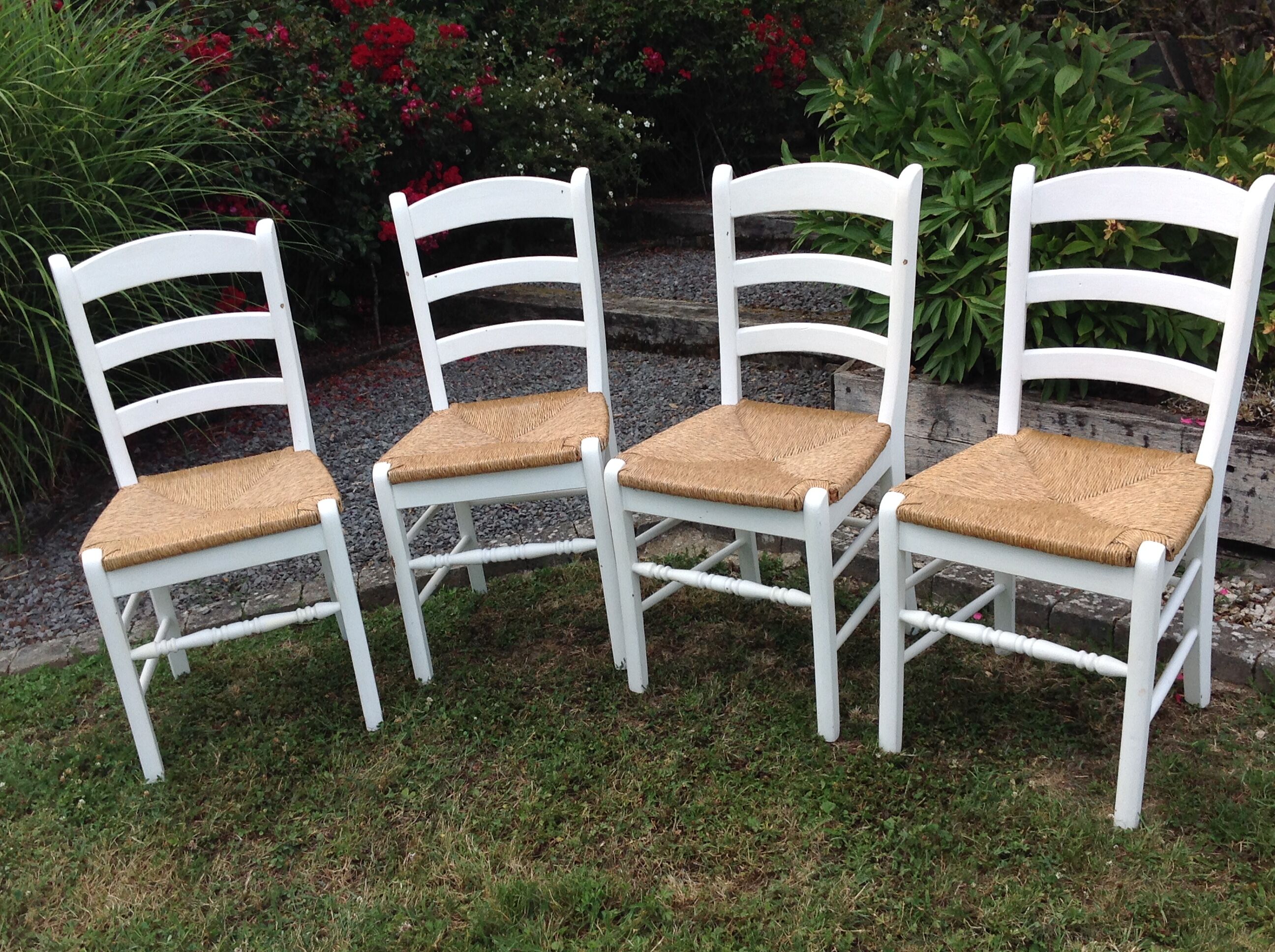 White farmhouse table set and four chairs