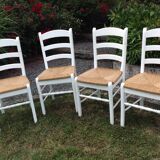 White farmhouse table set and four chairs