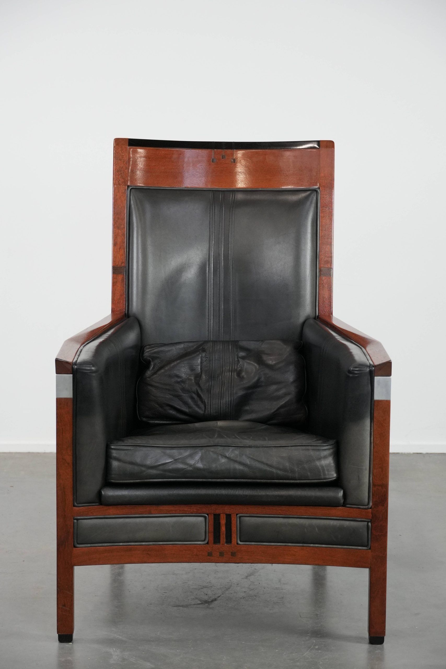 Black Art Deco cowhide leather and wooden design armchair with a high back