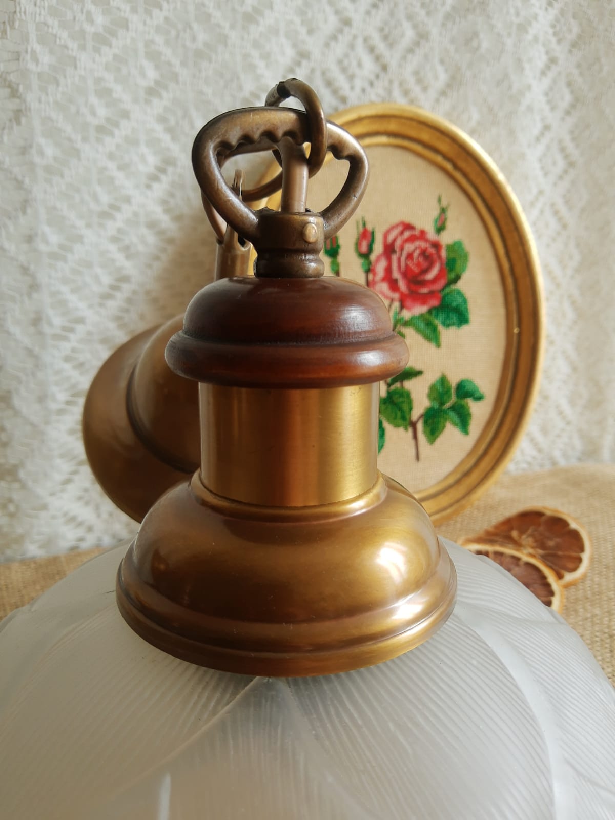 Pair of frosted glass flower pendant lights with vintage wood and brass