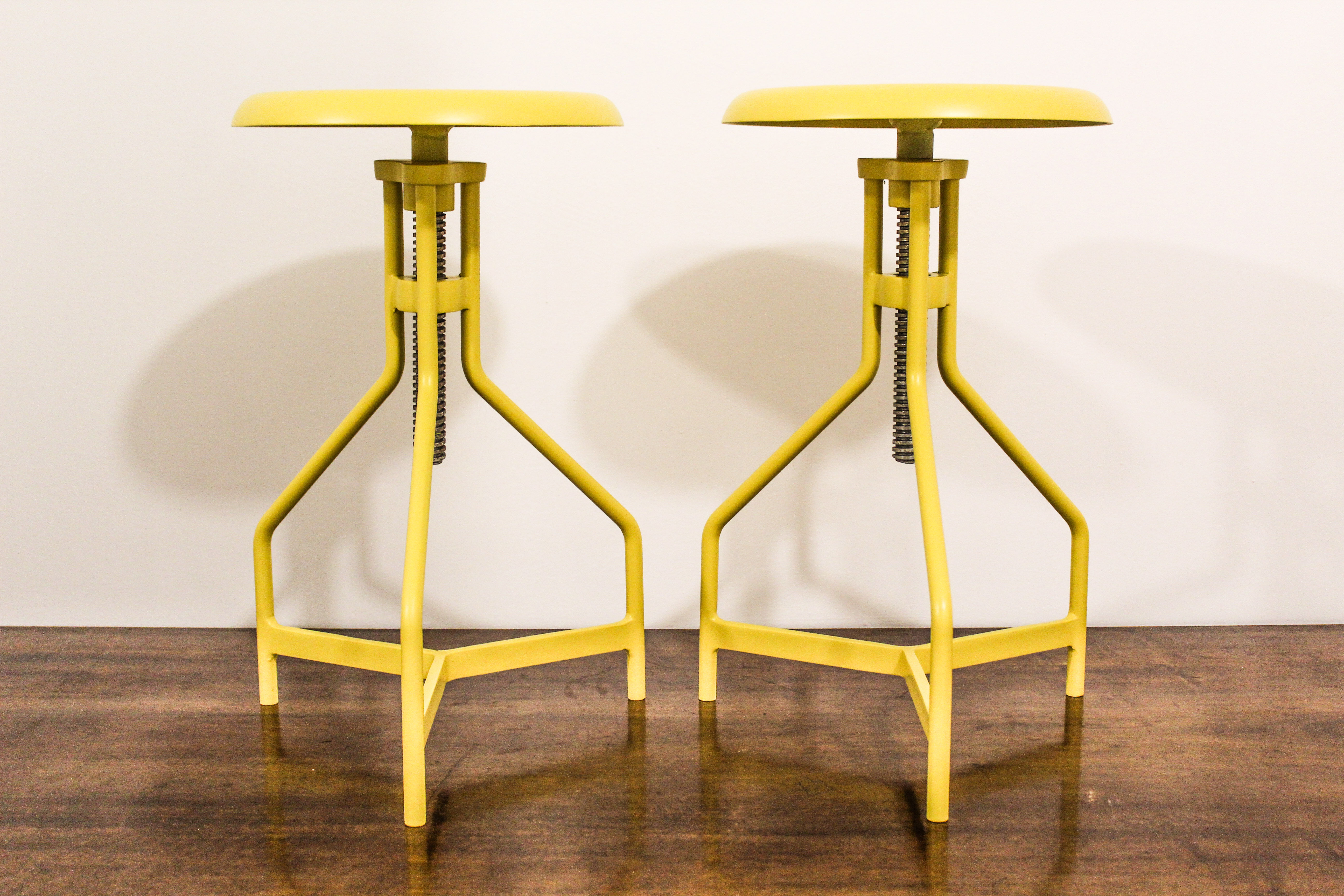 Pair of yellow lacquered metal stools, Restaurati, Italy 70's