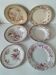 Set of 6 mismatched antique pink ironstone plates.