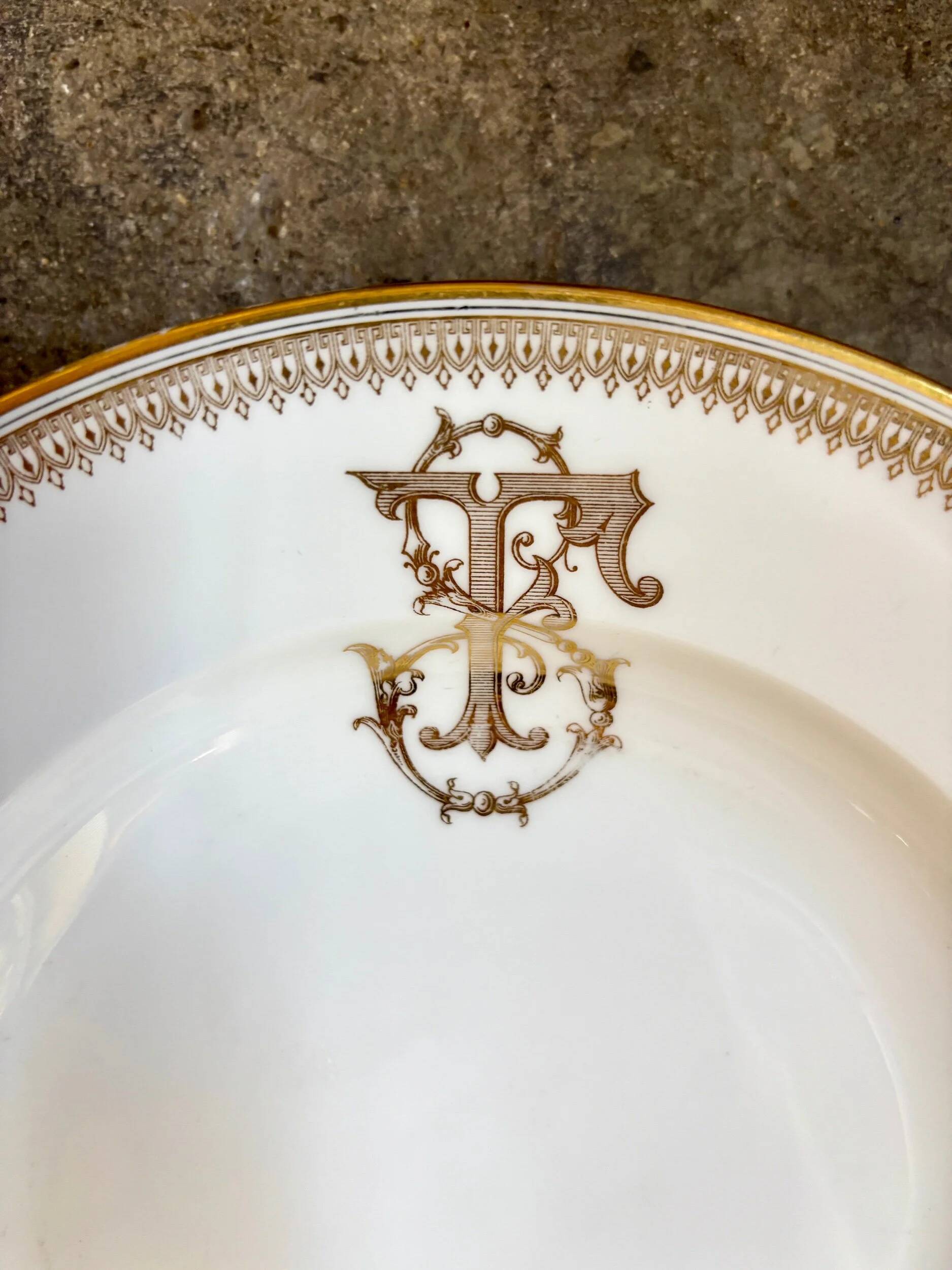 Gold monogrammed porcelain deep plate "F"