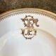 Gold monogrammed porcelain deep plate "F"